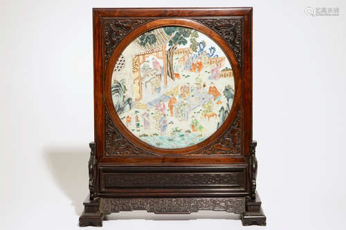 A Chinese zitan and huanghuali wood table screen with famille rose inset plaque, early 19th C.