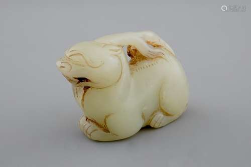 A Chinese celadon carving of an archaic deer, 18/19th C.