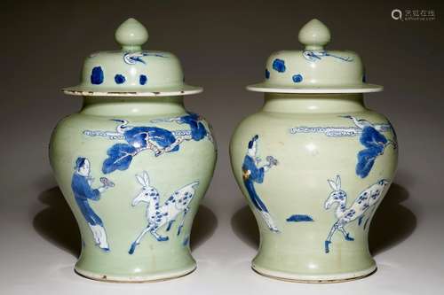 A pair of Chinese celadon, copper-red and underglaze blue vases and covers, Kangxi