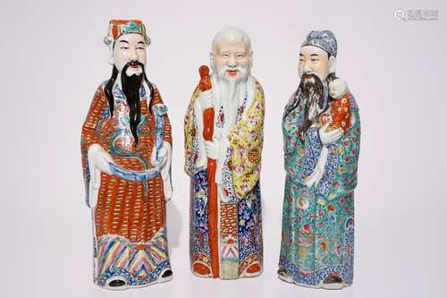 A set of three Chinese famille rose figures of immortals, 19/20th C.