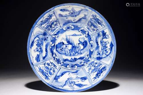 A Chinese blue and white dish with figures in a landscape, Transitional period