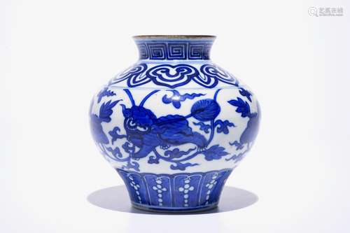 A Chinese blue and white baluster vase with buddhist lions, 19th C.