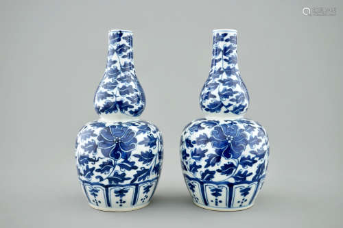 A pair of Chinese blue and white lotus scroll double gourd vases, Xuande mark, 19th C.