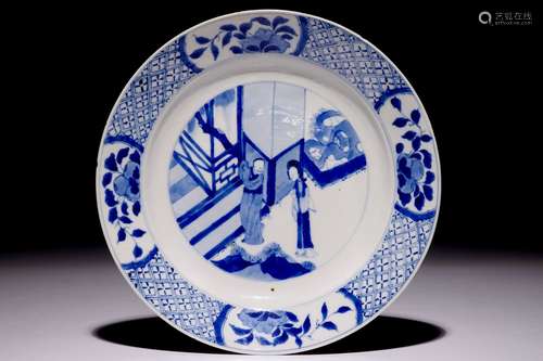 A Chinese blue and white plate with figures in the garden, Kangxi mark and of the period