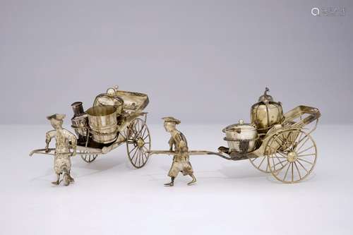 A pair of Chinese silver rickshaw-shaped pepper and salt shakers with a mustard container, 19th C.