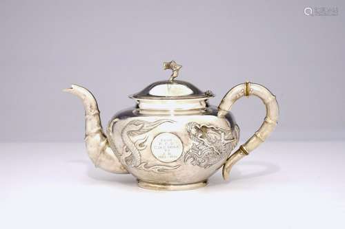 An inscribed Chinese silver teapot with dragon design, ca. 1880-1920