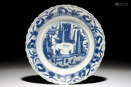 A Chinese blue and white fluted landscape dish, Ming