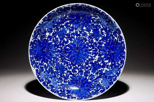 An exceptionally bright blue and white Chinese lotus scroll dish, Kangxi