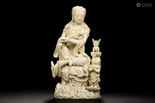 HE CHAOZONG: DEHUA BLANC DE CHINE CARVED GUANYIN FIGURE