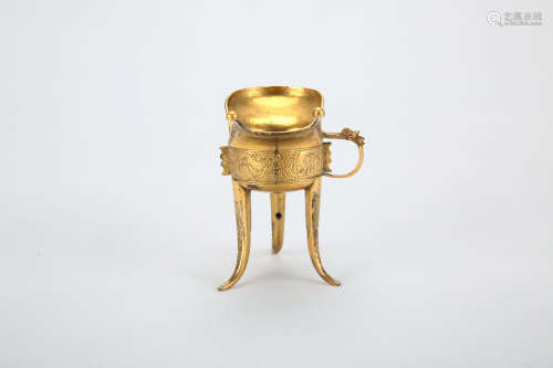 A Chinese Gilt Bronze TriPod Cup with Ear