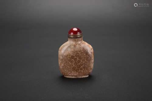 A Chinese Carved Coral Jade Snuff Bottle