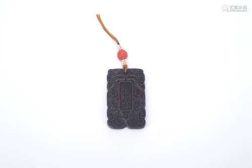 A Chinese Carved Wood Pendant