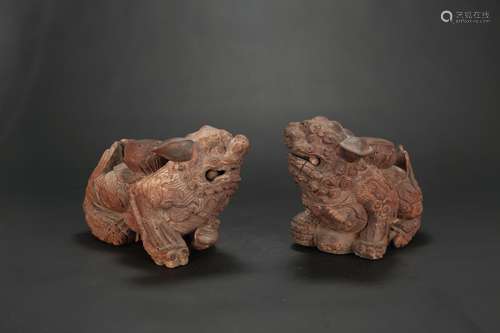 A Pair of Carved Stone Foo Dogs