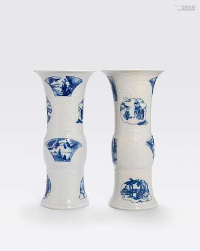 A PAIR OF MOLDED BLUE AND WHITEPORCELAIN BEAKER VASESKangxi period