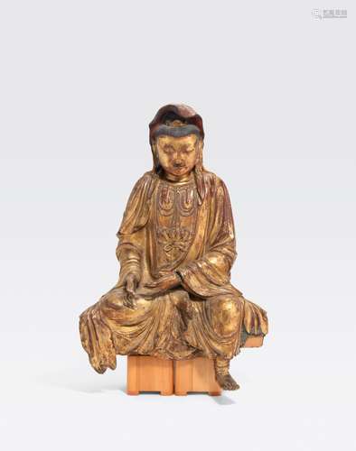 A LARGE GILT LACQUERED WOOD FIGURE OF A SEATEDBODHISATTVAQing dynasty