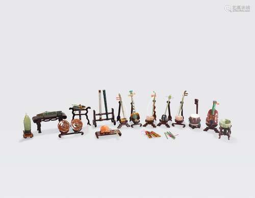 A PARTIAL SET OF MIXED HARDSTONE MINIATURE MUSICALINSTRUMENTS