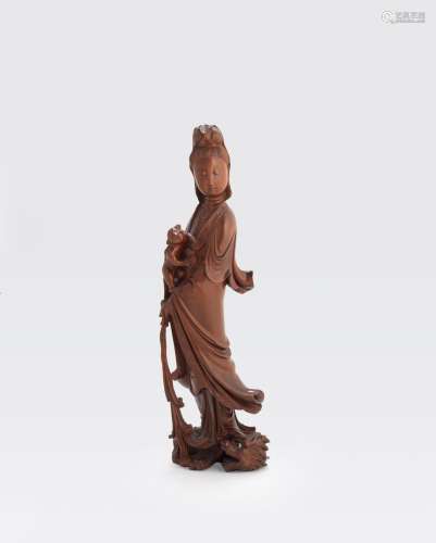 A BOXWOOD FIGURE OF GUANYIN AND BABY