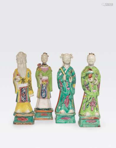 A GROUP OF FOUR FAMILLE ROSE ENAMELED IMMORTALS