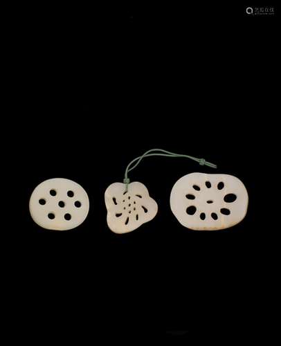 A GROUP OF THREE JADE LOTUS ROOT SECTIONS