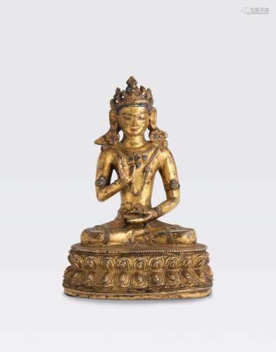 A GILT COPPER ALLOY FIGURE OF A CROWNED BUDDHA