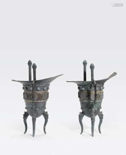 A PAIR OF BRONZE JUE-FORM WALL VASES