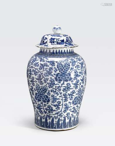 A LARGE BLUE AND WHITE JAR AND COVER