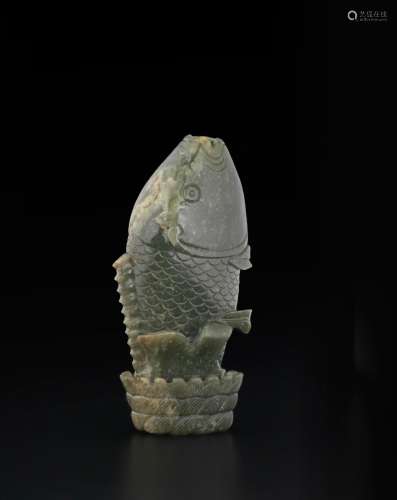 A GREEN JADE CARVING OF A LEAPING CARP