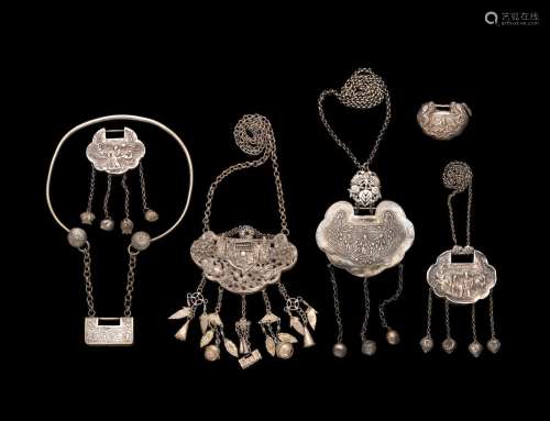 A GROUP OF SIX SILVER LOCKS AND NECKLACES