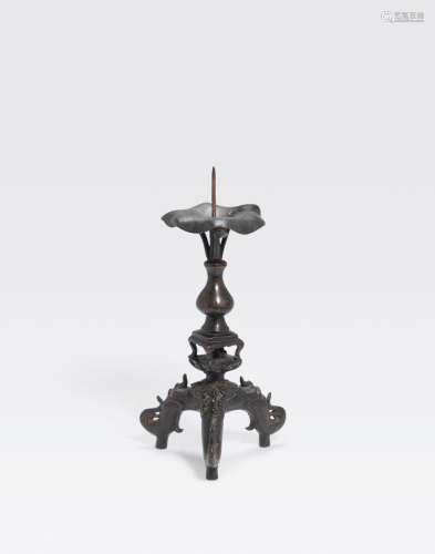 A BRONZE CANDLE PRICKET