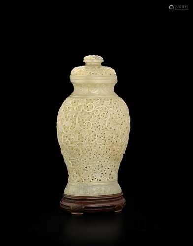 A CARVED JADE COVERED VASE