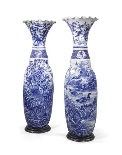 A PAIR OF MASSIVE BLUE-AND-WHITE OVOID PORCELAINURNS