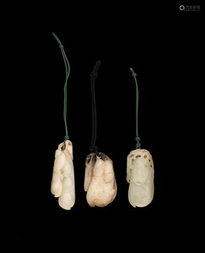 A GROUP OF THREE CARVED JADE VEGETABLE PENDANTS