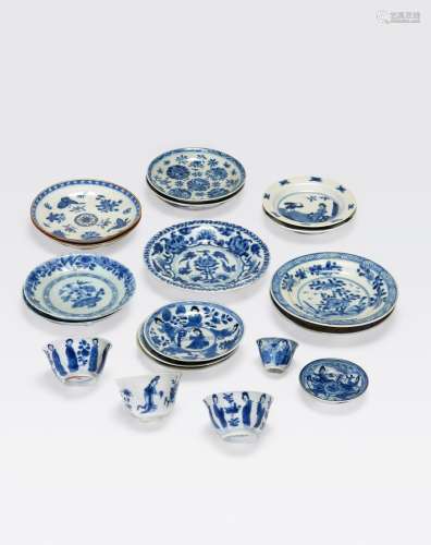 AN ASSEMBLED GROUP OF NINETEEN BLUE AND WHITESAUCERS AND SMALL CUPS