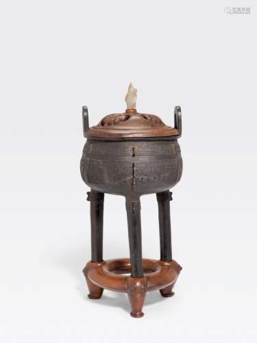 A BRONZE TRIPOD CENSER WITH WOOD COVER AND STAND
