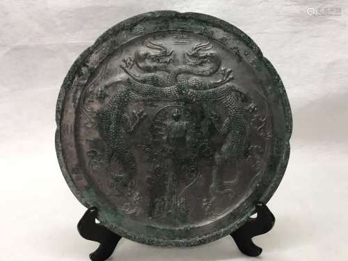 A SCALLOPED EDGED LOTUS SHAPED BRONZE MIRROR