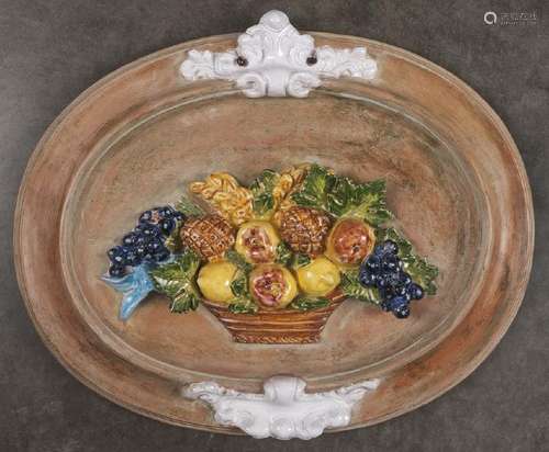 Terra cotta plaque with relief basket of fruit, s