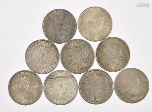 Nine silver dollars, to include five Morgan and f