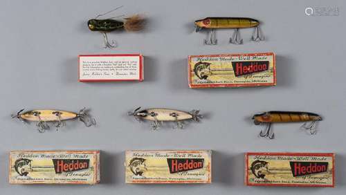 Five Heddon wood fishing lures in boxes, to inclu