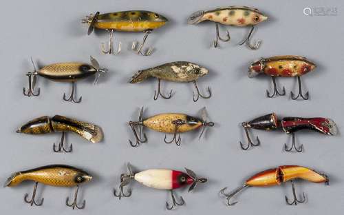 Eleven Heddon wood fishing lures, to include thre