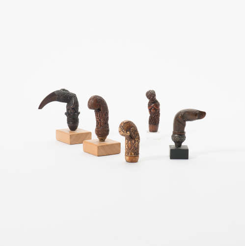 A collection of five Indonesian keris handles