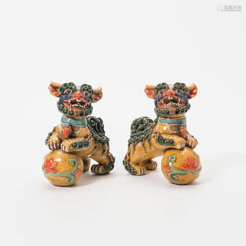 A pair of glazed stoneware Buddhist lions