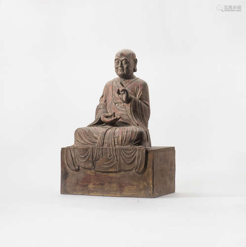 A Chinese wooden sculpture of a Luohan