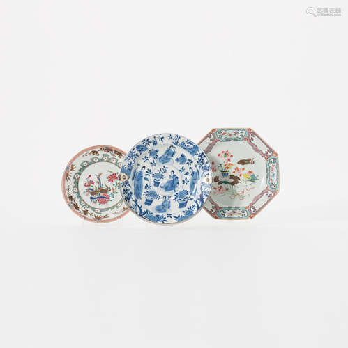 A Chinese blue and white plate and two famille rose plates