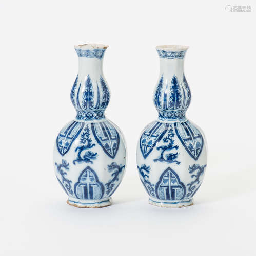 A pair of Dutch Delft earthenware blue and white chinoiserie vases