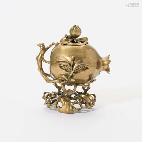 A Chinese bronze 'pomegranate' censer, cover and stand