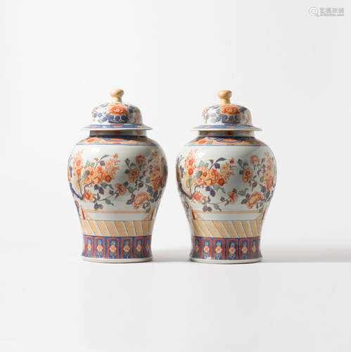 A pair of large Imari baluster vases and covers