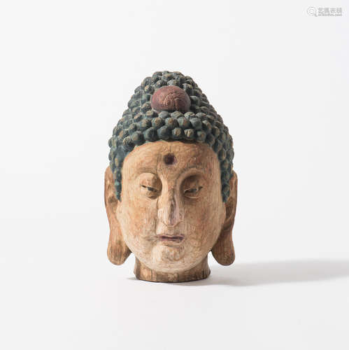 A polychrome wood Ming style Buddha head