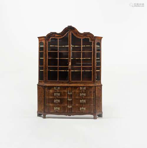 A Dutch serpentine shaped display cabinet with walnut veneer