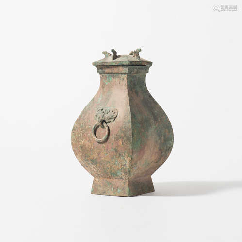 A Chinese ritual bronze wine vessel and cover, fanghu