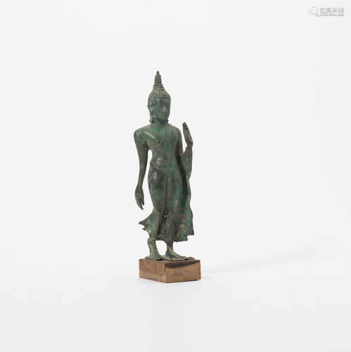 A Thai bronze figure of a walking Buddha